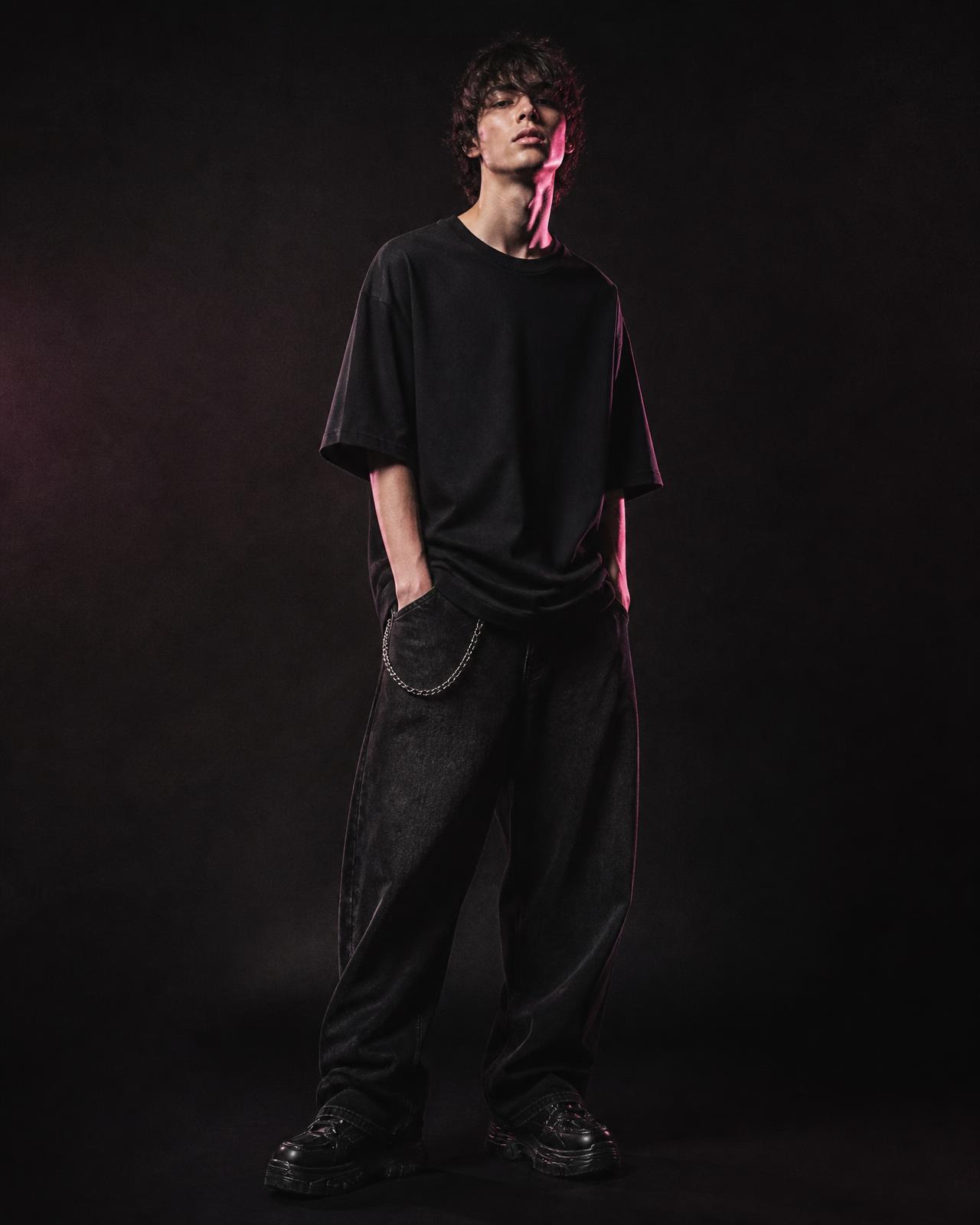 Model wearing an oversized black notsoobasic t-shirt